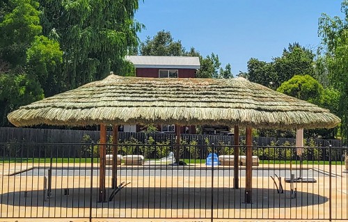 Example: 17x29 Tahitian Palm Tiki Hut. Options shown: Canyon Brown stain, Thatch Save netting, Palapa Stands 