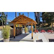 Example: African Reed Tiki Hut Gable Roof. Cedar Stain, Palapa Stands, Rope Kit, 